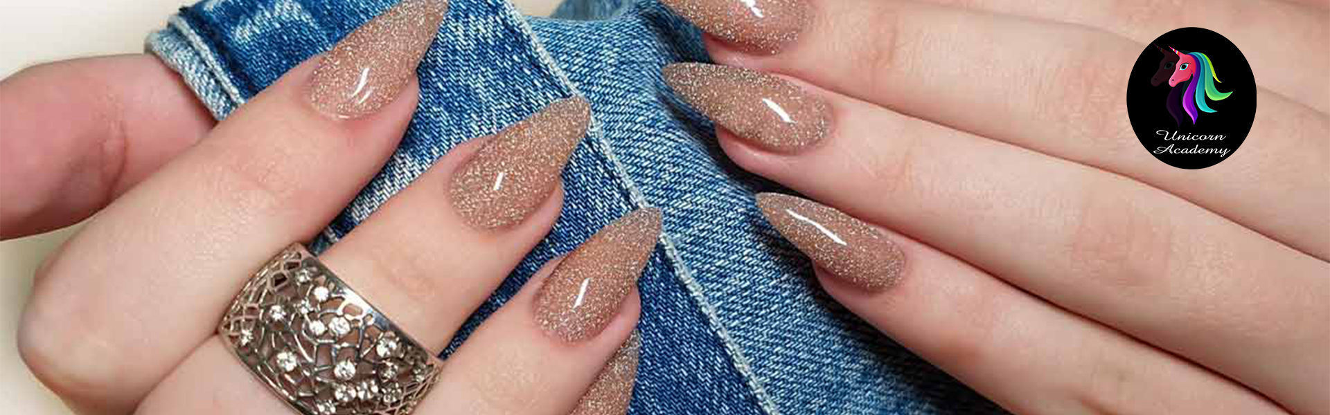 Unicorn Academy India | Close-up of elegant nail extensions with a subtle pearlescent gleam.